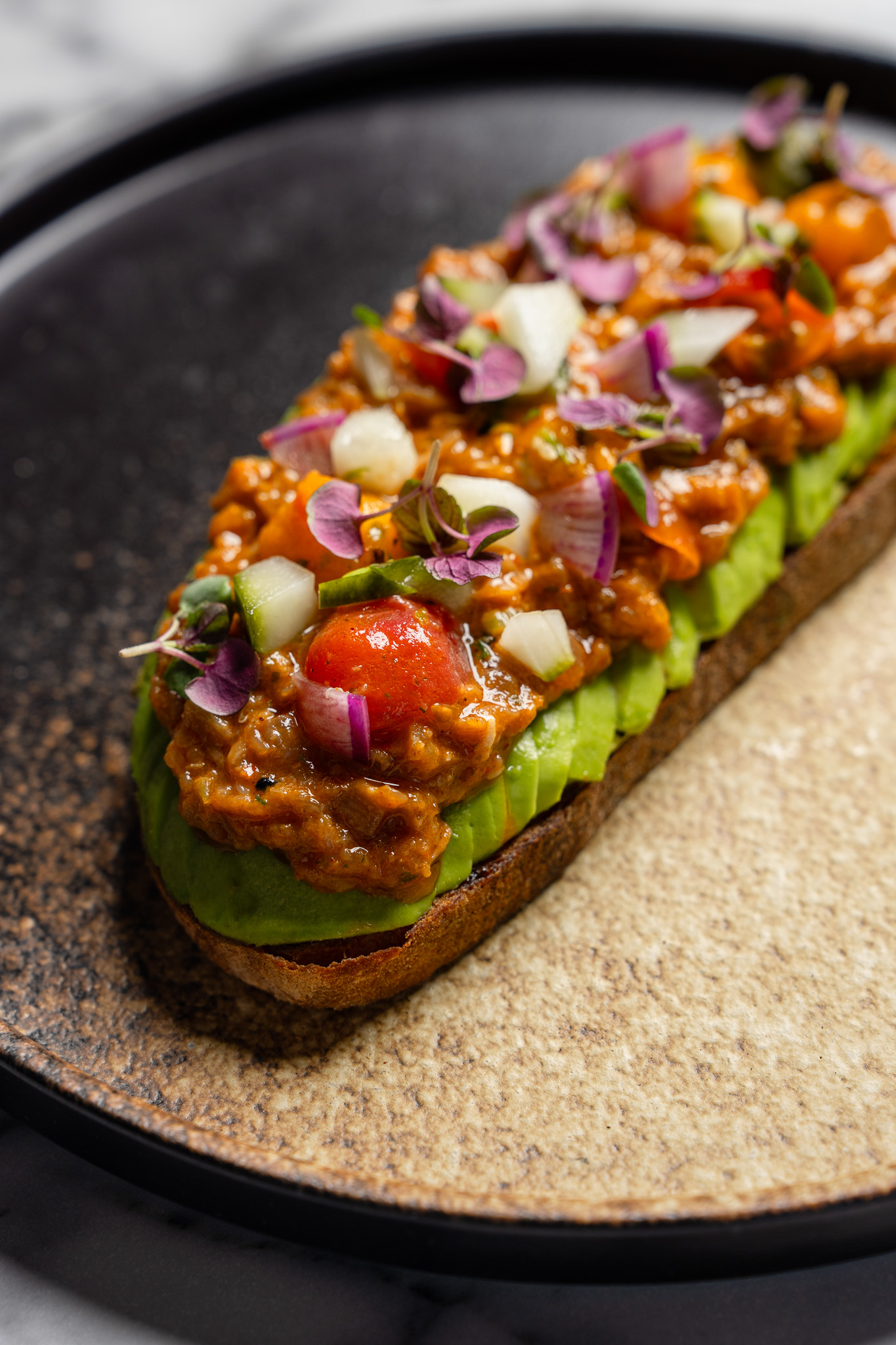 Spicy Tuna Toast at Cherryfish, avocado, cucumber sunomono, organic sourdough