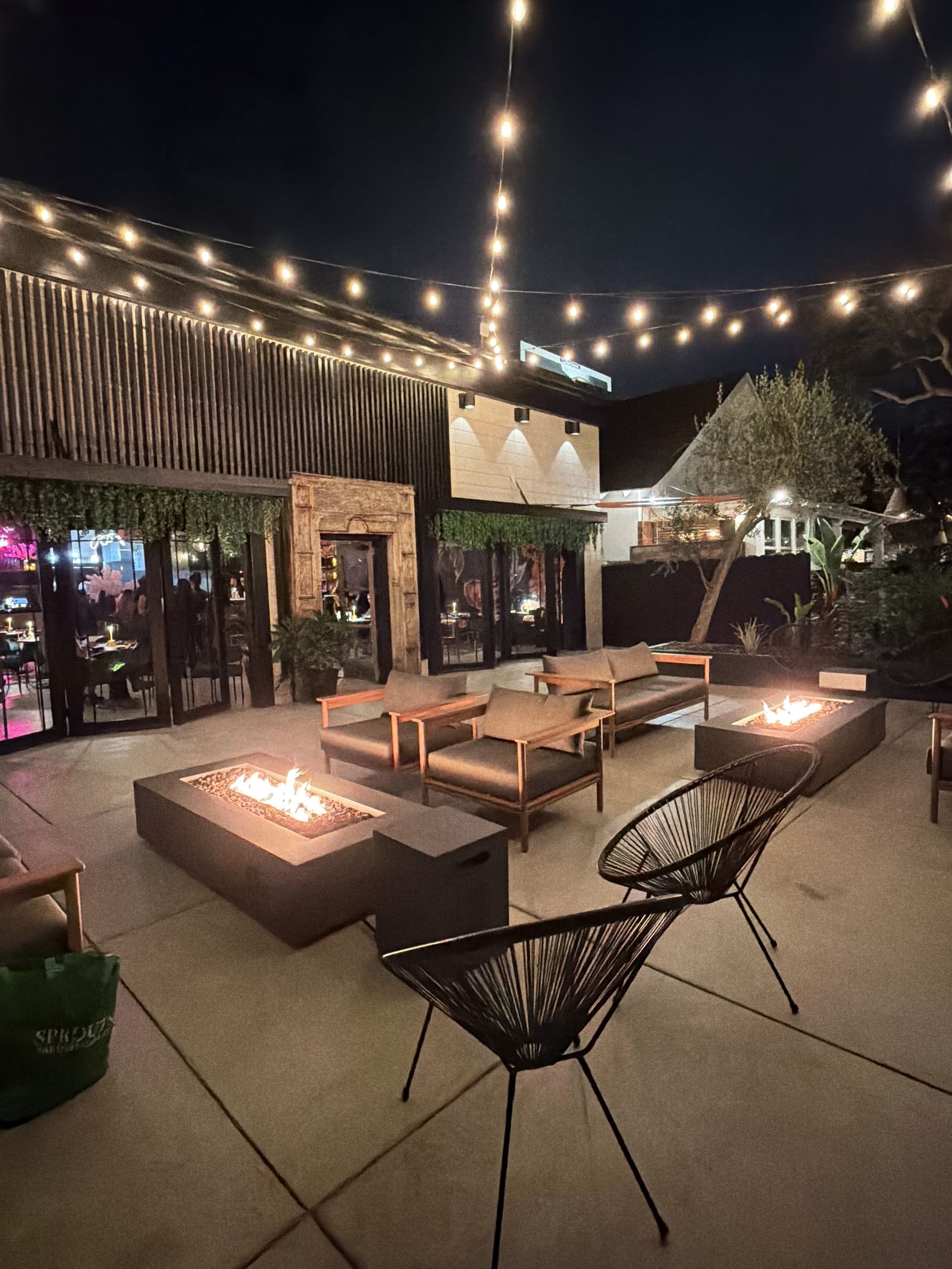 Cherryfish patio entry archway and lounge area lit at night for a private event in Pacific Beach San Diego