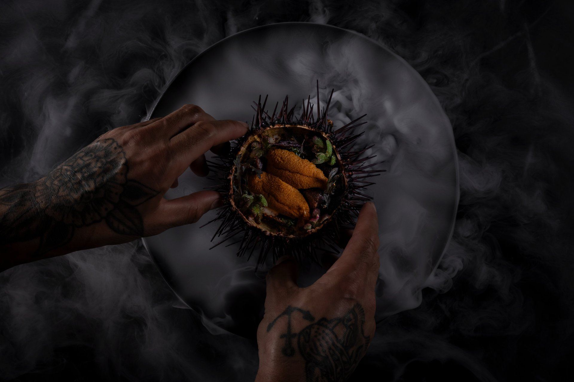 Craft cocktail and sushi roll by the fire pit on the patio at Cherryfish, Pacific Beach San Diego