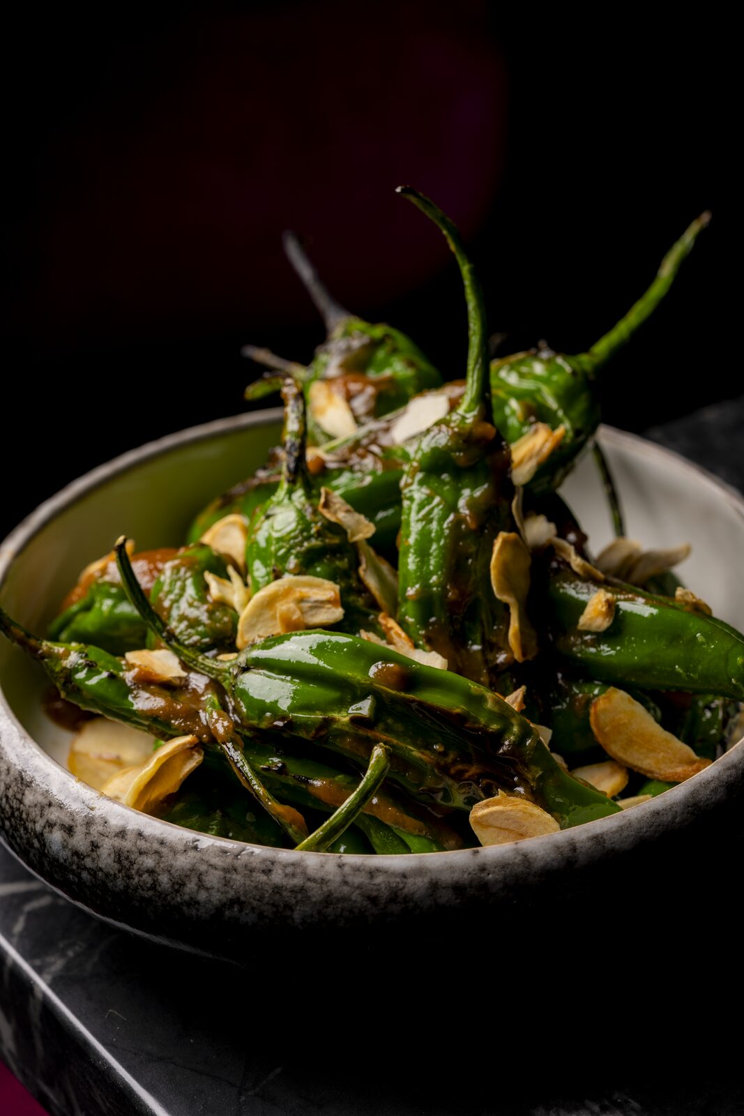 Blistered shishito peppers with crispy garlic at Cherryfish, Pacific Beach San Diego